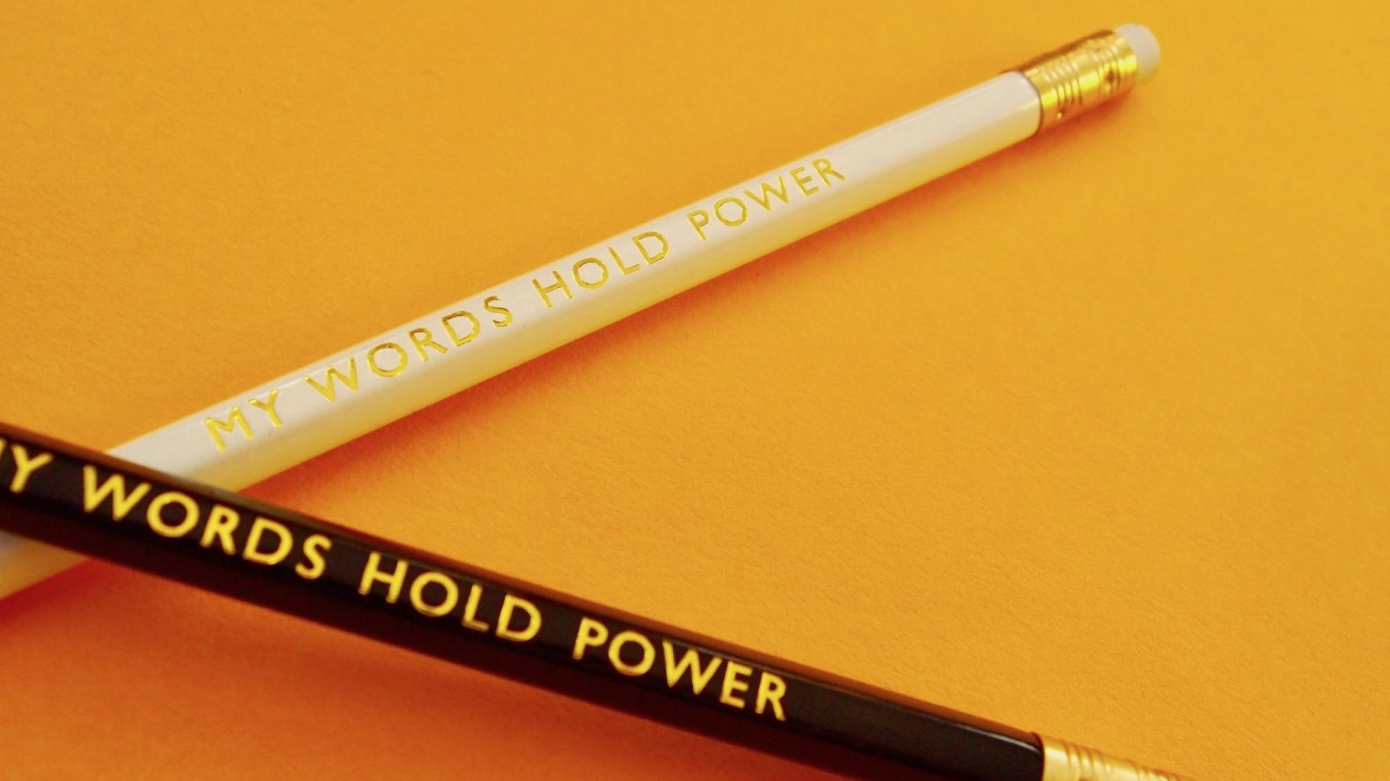 Pencils with "words hold power" affirmation
